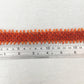 Orange Beaded Bracelet with Red Crystals